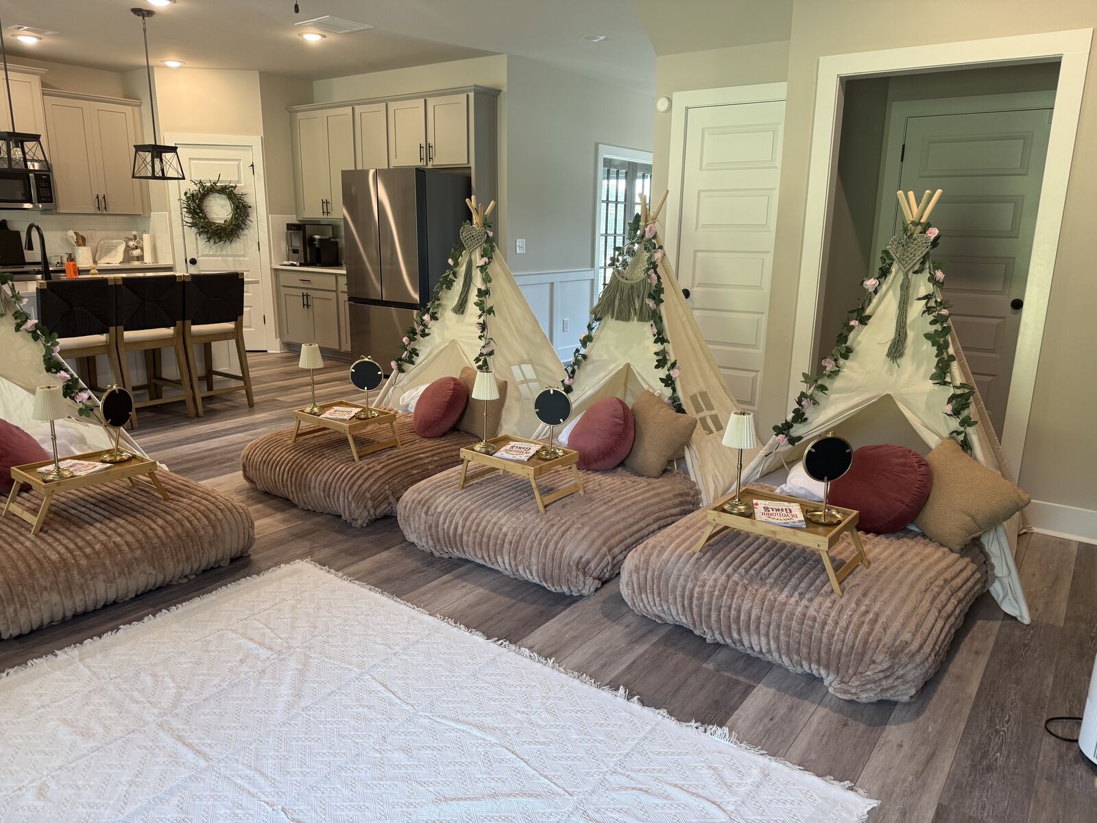 Right-side view of coordinated teepees, bedding, lamps, and trays