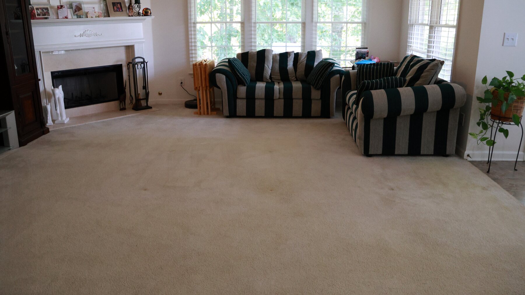 Open living room before a navy-and-gold teepee sleepover setup
